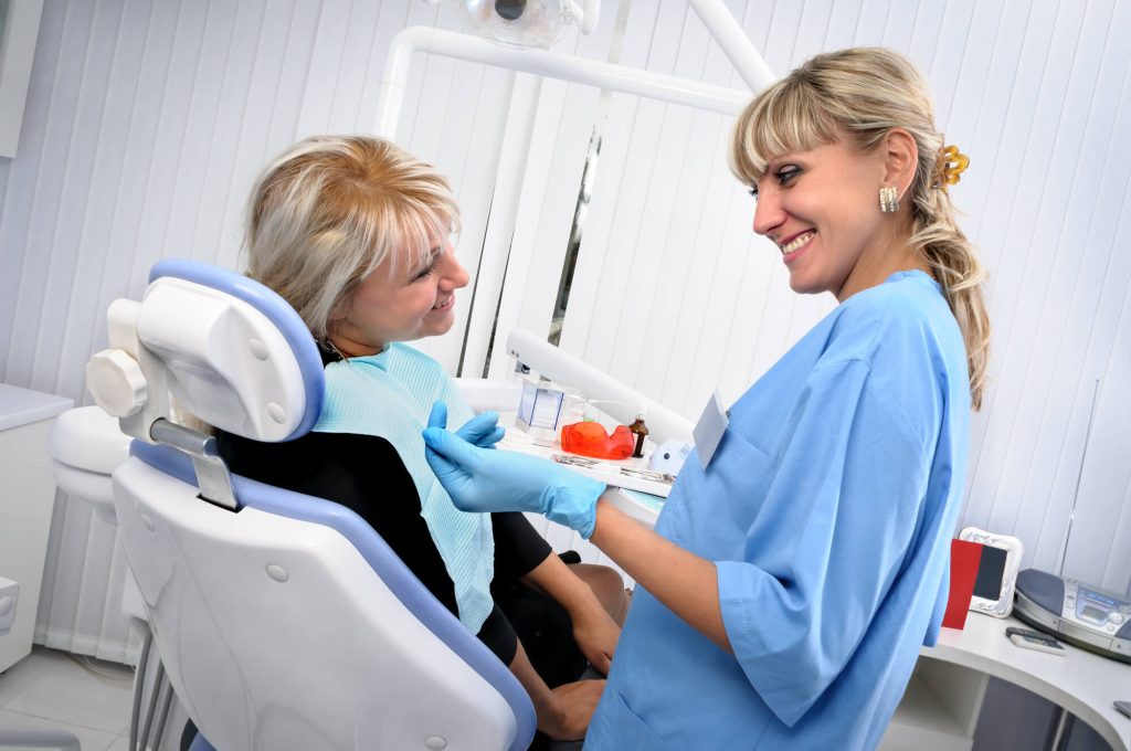 A female patient and a female dentist during a conversation